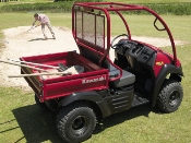 Kawasaki Mule 600 Utility Vehicle on Golf Course Kawasaki Mule 600 Utility Vehicle on Golf Course